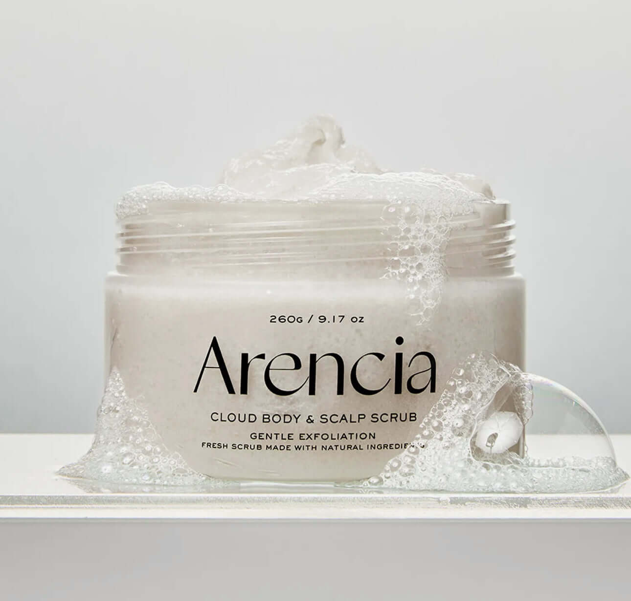 Arencia Fresh Cloud Body & Scalp Scrub-Lavender & Pear in a jar with gentle exfoliation bubbles.