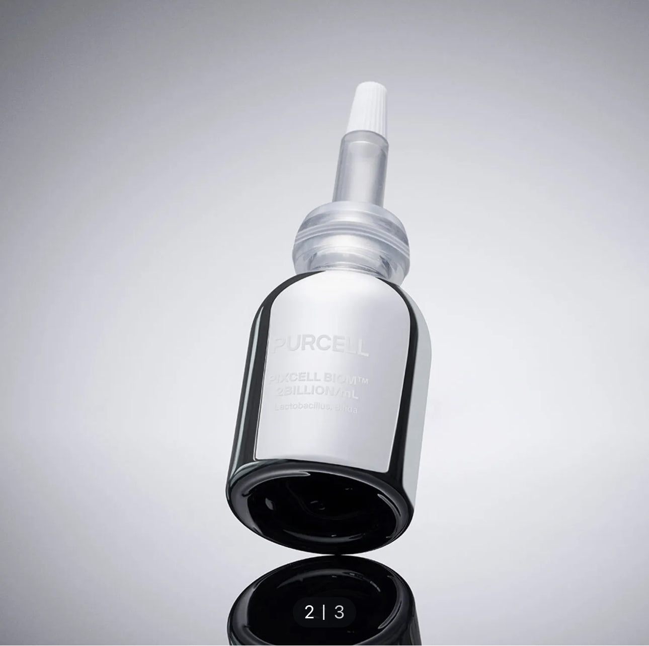 PURCELL Pixcell Biom 2 Billion/mL 20mL serum bottle reflecting light on a smooth surface.