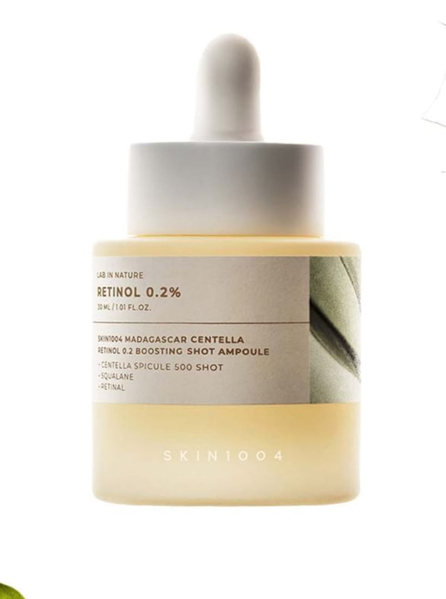 Skin1004 Madagascar Centella Retinol 0.2% Boosting Shot Ampoule -30ml in a glass bottle with dropper.