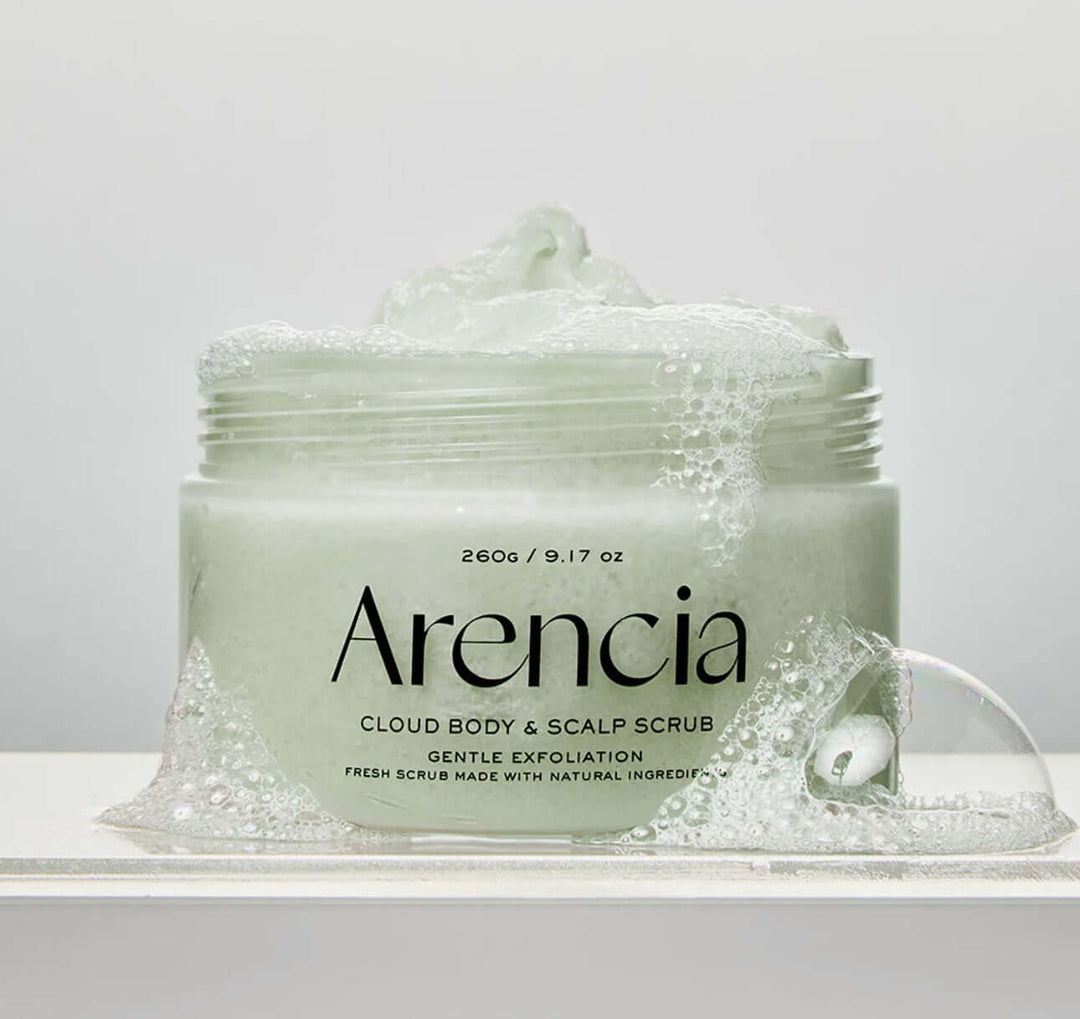 Arencia Fresh Cloud Body & Scalp Scrub-Lavender & Pear in a clear jar with bubbles and creamy texture.