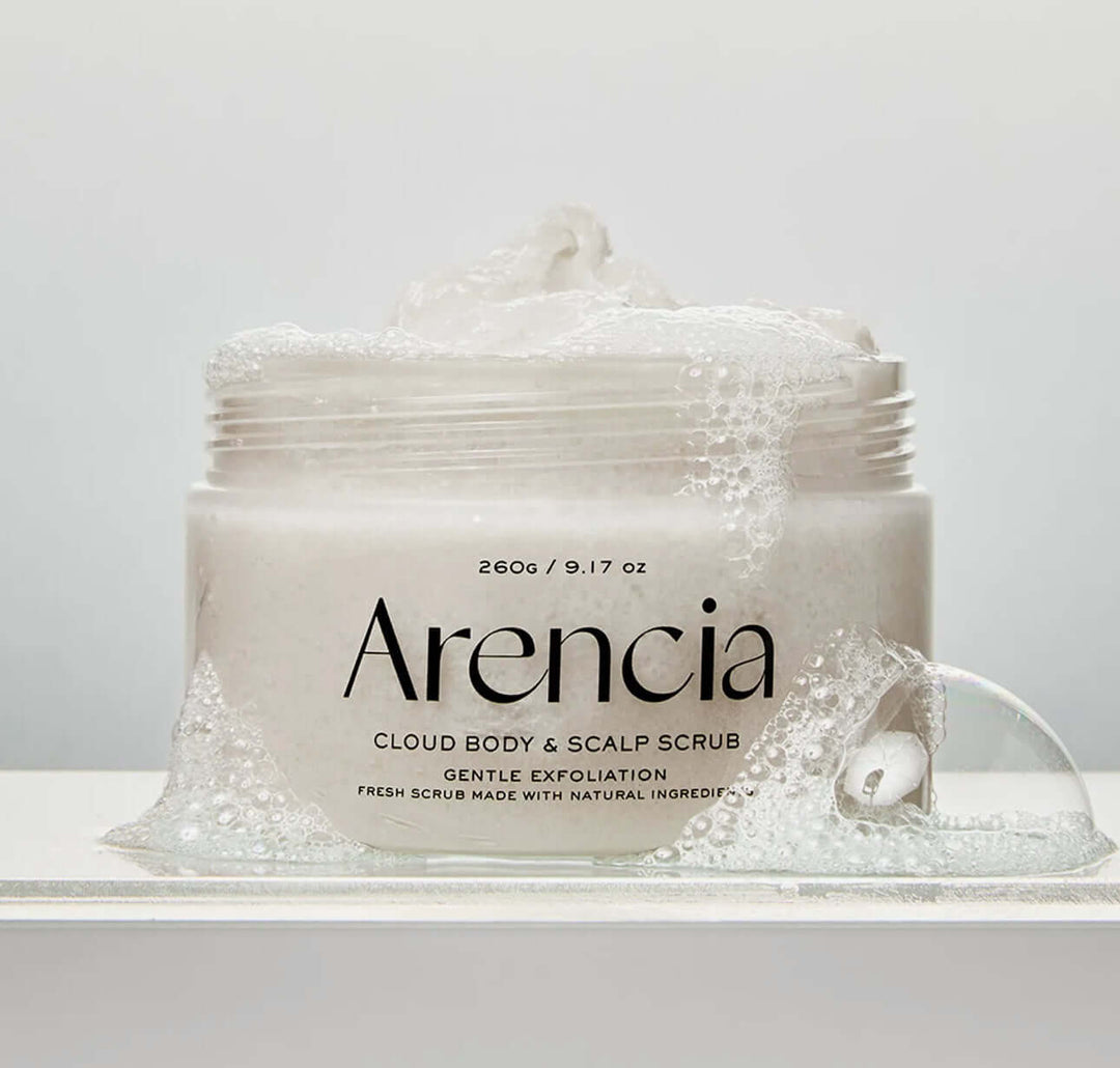 Arencia Fresh Cloud Body & Scalp Scrub-Lavender & Pear in a jar with gentle exfoliation bubbles.
